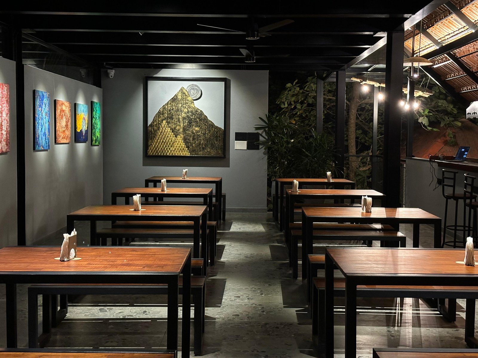 Inside Day One — long benches and art